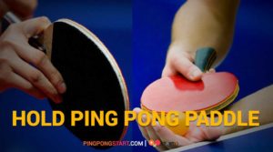 Hold ping pong paddle
